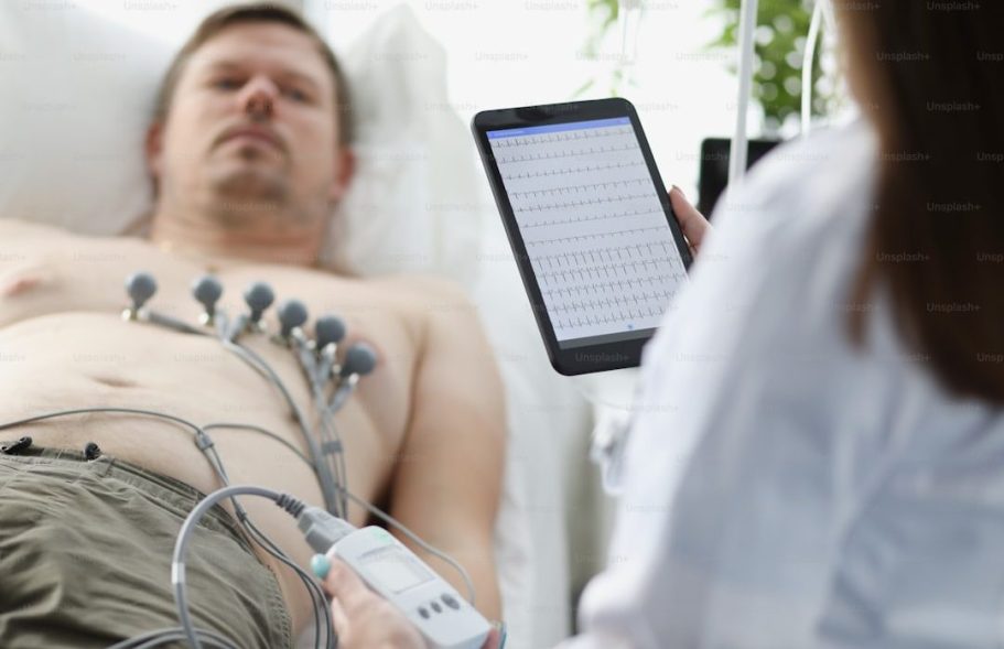 Patient undergoing a resting ECG (electrocardiogram) to assess heart rhythm and electrical activity.